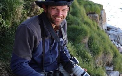 Shiloh in the field with his camera